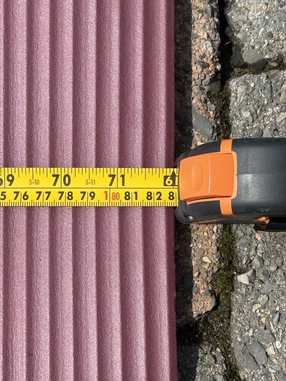 Close-up of a steel tape measuring the calibration target for ground truth